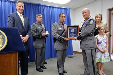 photo of Trooper Segur receiving award