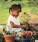 Picture of child planting flowers